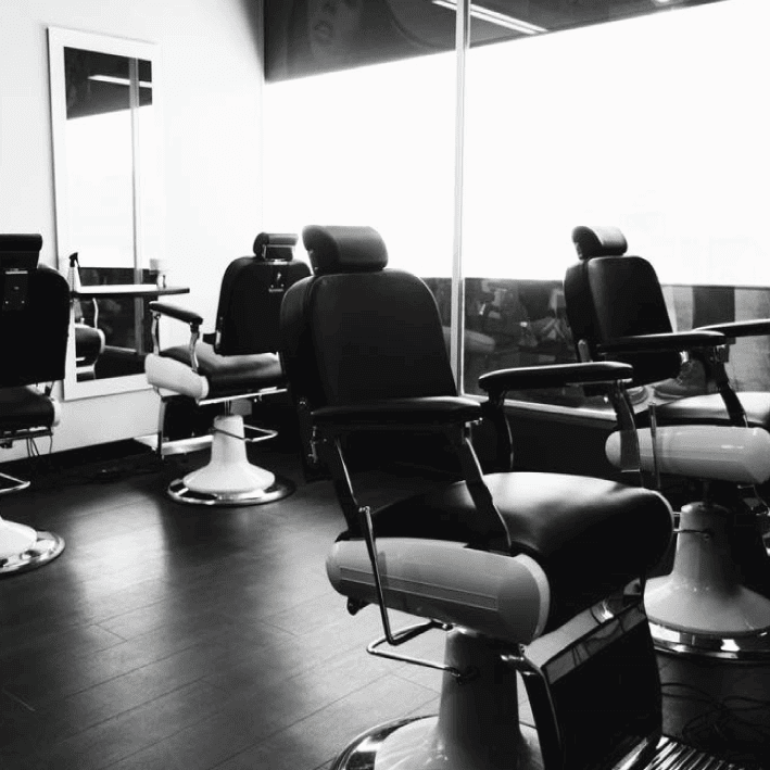 Get Smart Hair several barber chairs black and white image