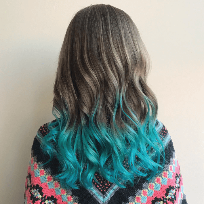 Get Smart Hair Back of woman's head with long wavy hair brown to blue ombre